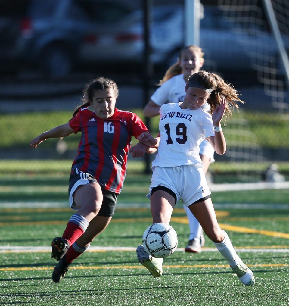 Red Hook's Ani Safaryan competes for possession with New Paltz's Leah Schamberg during a Section 9 Class A girls soccer semifinal on October 28, 2021.