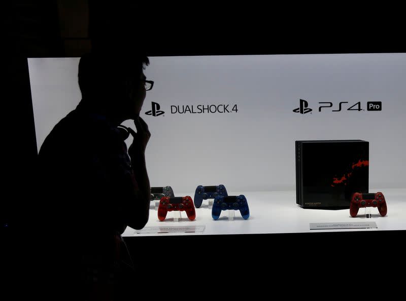 A visitor looks at displays of Sony's PlayStation 4 at Tokyo Game Show 2017 in Chiba