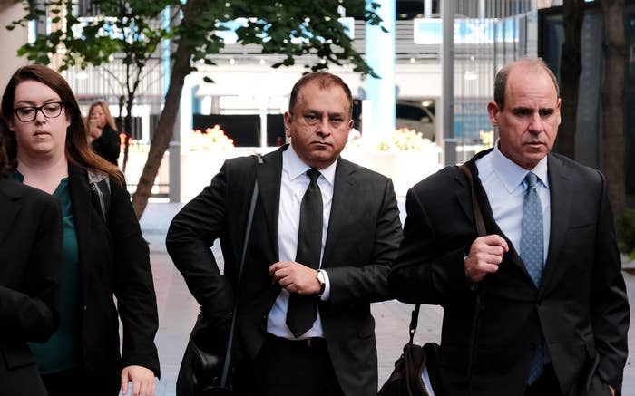 Ramesh “Sunny” Balwani and his legal team leave the federal courthouse in downtown San Jose, California, on July 7, 2022.