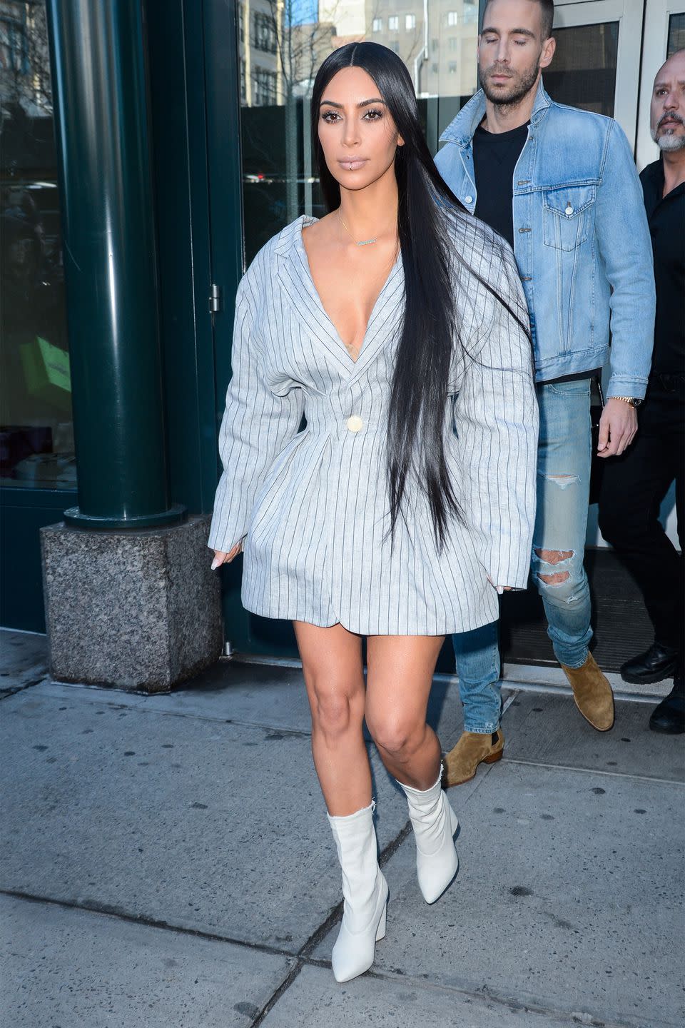 <p>In a striped blazer dress, white ankle boots, Calabasas necklace, and lip ring while out in NYC. </p>