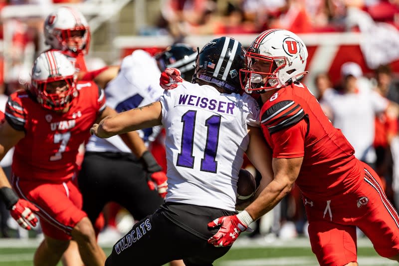 Utah Utes safety Cole Bishop (8) tackles Weber State Wildcats quarterback Kylan Weisser (11) during game at Rice-Eccles Stadium in Salt Lake City on Saturday, Sept. 16, 2023. | Megan Nielsen, Deseret News