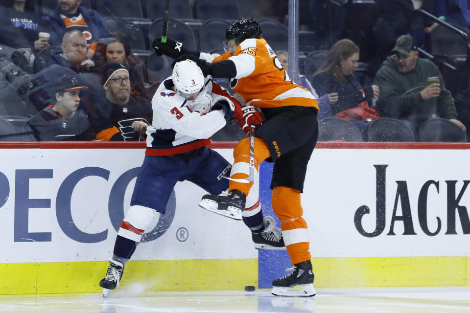 Philadelphia Flyers' James van Riemsdyk, right, collides with Washington Capitals' Nick Jensen during the second period of an NHL hockey game Wednesday, Jan. 8, 2020, in Philadelphia. (AP Photo/Matt Slocum)