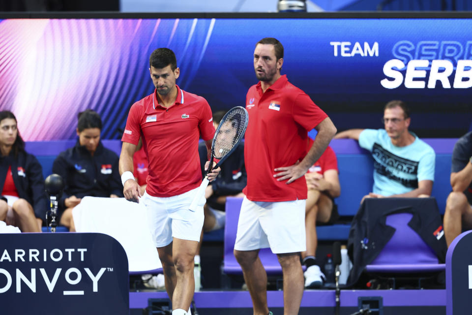 Novak Djokovic of Serbia, centre left, is encouraged by team captain Viktor Troicki during his match against Alex de Minaur of Australia during the United Cup tennis tournament in Perth, Australia, Wednesday, Jan. 3, 2024. (AP Photo/Trevor Collens)