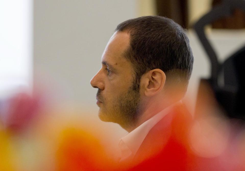 Salvatore Ferragamo's creative director, Massimiliano Giornetti, talks during an interview with the Associated Press, in Paris, Thursday, June 14, 2012. (AP Photo/Jacques Brinon)