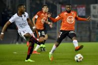 Lorient's French midfielder Makengo Arnold Mvuemba (R) vies with Nice's French midfielder Wylan Cyprien during the French L1 football match Lorient vs Nice at the Moustoir stadium in Lorient, western France, on February 18, 2017