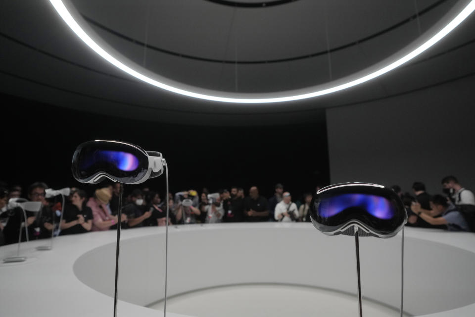 A pair of Apple Vision Pro headsets are displayed in a showroom on the Apple campus Monday, June 5, 2023, in Cupertino, Calif. (AP Photo/Jeff Chiu)