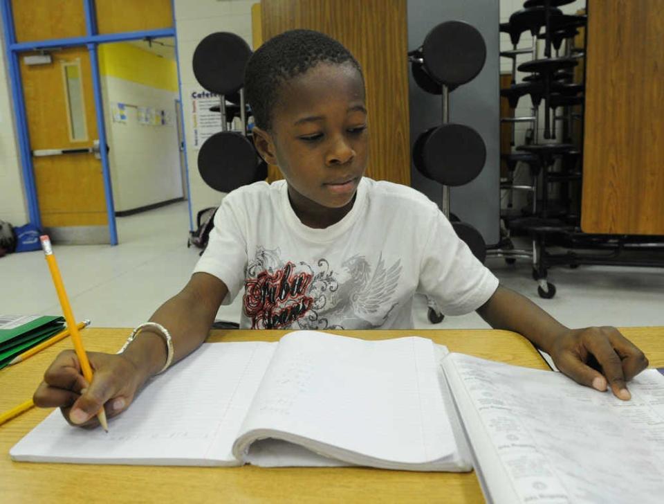 FILE - A student works on his homework during after school care at Stevens Creek Elementary. The Columbia County school scored high marks in Readiness and Content Master the most recent version of Georgia's College and Career Ready Performance Index.