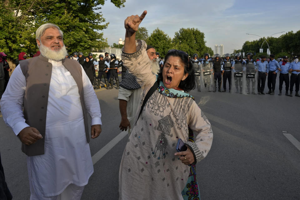 Supporters of Pakistan's former Prime Minister Imran Khan chant slogans outside Supreme Court as they celebrate after court decision, in Islamabad, Pakistan, Thursday, May 11, 2023. Pakistan’s Supreme Court has ordered the release of Khan, whose arrest earlier this week sparked a wave of violence across the country by his supporters. (AP Photo/Anjum Naveed)