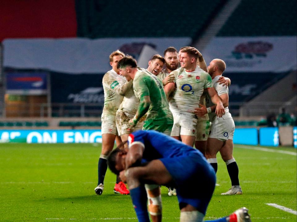 England players celebrate with captain Owen Farrell (AFP via Getty Images)