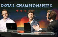 Commentators make points during The International Dota 2 Championships at Key Arena in Seattle, Washington August 8, 2015. REUTERS/Jason Redmond