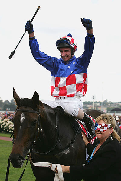 <p>Glen Boss celebrates on Makybe Diva as he returns to scale after winning the Melbourne Cup for the third year in a row during The Melbourne Cup Carnival at Flemington Racecourse</p>