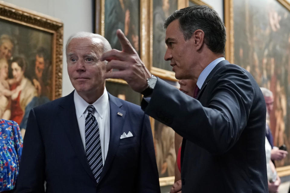 Spanish Prime Minister Pedro Sanchez, right speaks with U.S. President Joe Biden during a visit to the Prado museum with heads of state and dignitaries in Madrid, Spain, Wednesday, June 29, 2022. North Atlantic Treaty Organization heads of state are meeting for a NATO summit in Madrid from Tuesday through Thursday. (AP Photo/Andrea Comas)