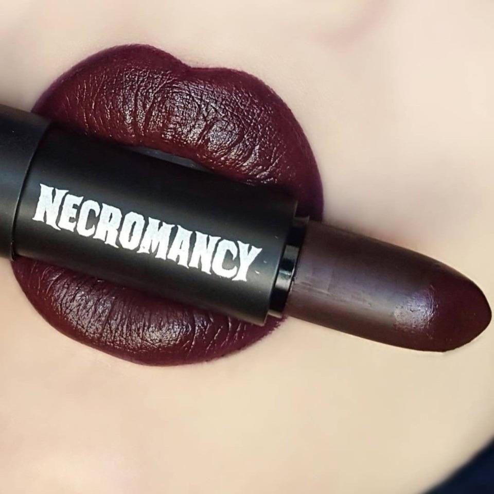 <p><strong>Necromancy Cosmetica</strong></p><p>necromancycosmetica.com</p><p><strong>$16.00</strong></p><p>The goth makeup brand was founded by couple <a href="https://remezcla.com/features/culture/necromancy-cosmetica-puerto-rico/" rel="nofollow noopener" target="_blank" data-ylk="slk:Desiree Rodríguez and Salvador Pérez;elm:context_link;itc:0;sec:content-canvas" class="link ">Desiree Rodríguez and Salvador Pérez</a> in Puerto Rico in 2015. Their <strong>matte lipsticks come in deep reds, purples and greens,</strong> which are also vegan and cruelty-free. The <a href="https://necromancycosmetica.com/collections/pigments-eyeshadows/products/a-gothic-romance-palette" rel="nofollow noopener" target="_blank" data-ylk="slk:Gothic Romance Palette;elm:context_link;itc:0;sec:content-canvas" class="link ">Gothic Romance Palette</a> will elevate your look with pigmented eyeshadows.</p>