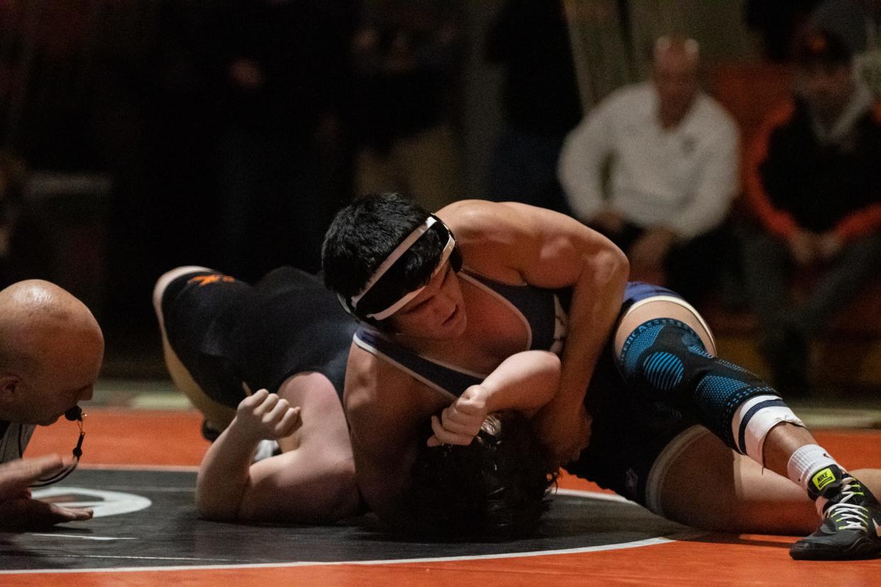 Council Rock South's Bek Sadriddinov picks up back points against Pennsbury's Austin Flinn in a 172-pound match on Wednesday, January 24, 2024, in Falls Township. The Golden Hawks defeated the Falcons 52-9.