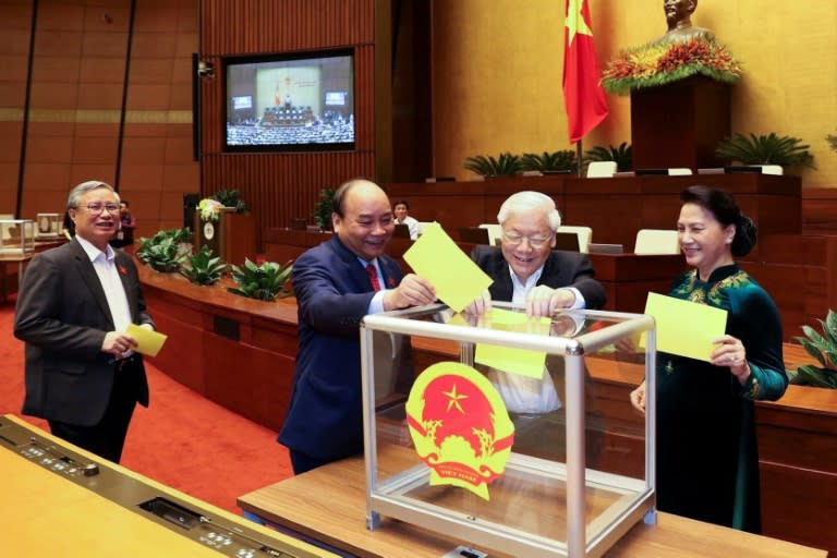 Nguyen Phu Trong (2nd-R) won 99.8 percent of the vote, with only one lawmaker voting against him