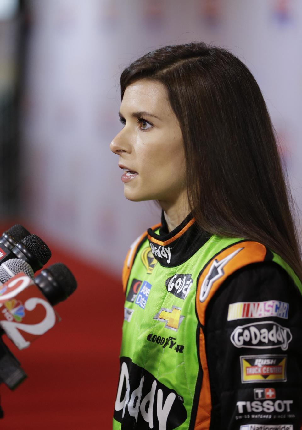 Driver Danica Patrick answers questions during NASCAR auto racing media day at Daytona International Speedway in Daytona Beach, Fla., Thursday, Feb. 13, 2014. (AP Photo/John Raoux)