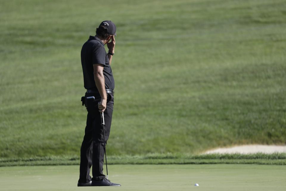 Phil Mickelson reacts to a putt on the 14th hole during the second round of the Workday Charity Open golf tournament, Friday, July 10, 2020, in Dublin, Ohio. (AP Photo/Darron Cummings)