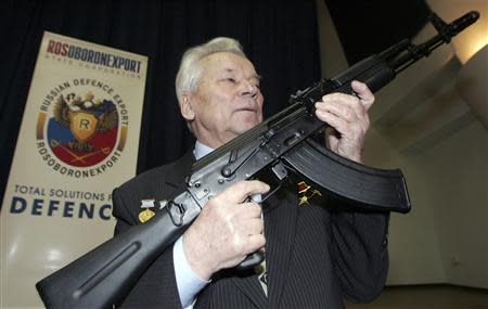 Mikhail Kalashnikov, chief designer of Izhmash Concern, a Russian firearms producer, poses with the latest model of his rifle during a news conference in Moscow in this April 15, 2006 file photo. REUTERS/Sergei Karpukhin/Files