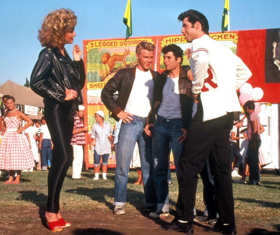 Olivia Newton-John (R) and John Travolta (L) in Grease | Moviestore/Shutterstock