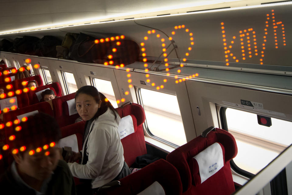 A display shows the speed aboard a high-speed train in Hebei province south of Beijing on December 22, 2012. China showed off the final link of the world's longest high-speed rail route, set to open on December 26, stretching from Beijing to the southern Chinese city of Guangzhou. Travelling at around 300 kph, trains on the new route are expected to cover the 2,298-kilometre (1,425-mile) journey in a third of the current time from 22 hours to eight. AFP PHOTO / Ed Jones