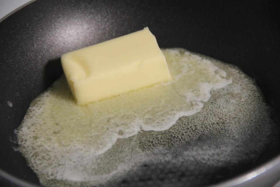 Butter melting in a saucepan.