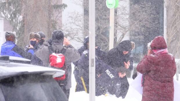 An anti-mask protest took place in Moncton on Jan. 24 and five people were arrested. (Radio-Canada  - image credit)