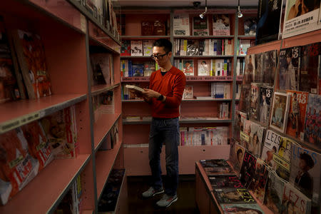 Yang Pingjing, 45, one of the owners of Gin Gin bookshop, a hub for LGBT rights activists, poses for a photograph in Taipei, Taiwan, November 16, 2018. REUTERS/Ann Wang