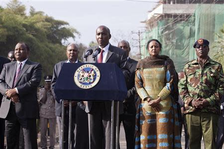 Kenya's Interior Minister Joseph ole Lenku (C), flanked other government officials, speaks during a news conference near the Westgate shopping mall in Nairobi September 25, 2013. REUTERS/Siegfried Modola