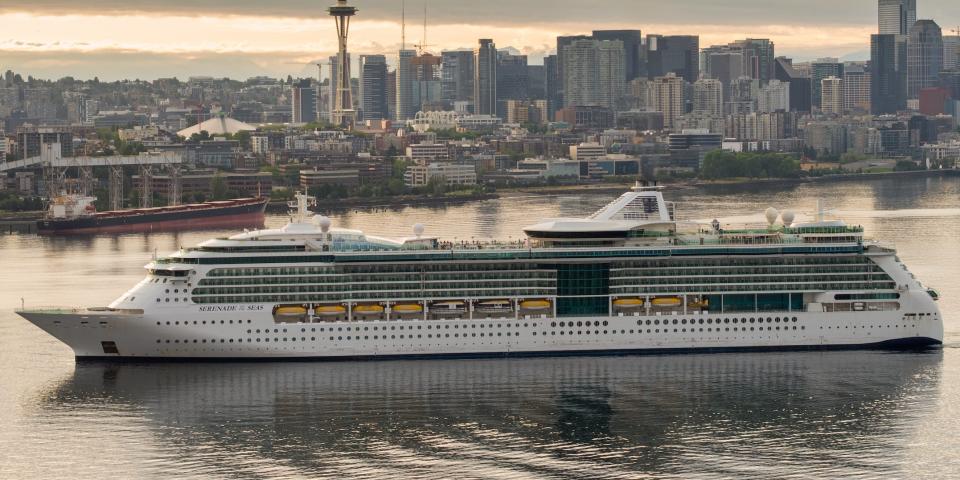 the Serenade of the Seas in the water with the Seattle skyline in the back