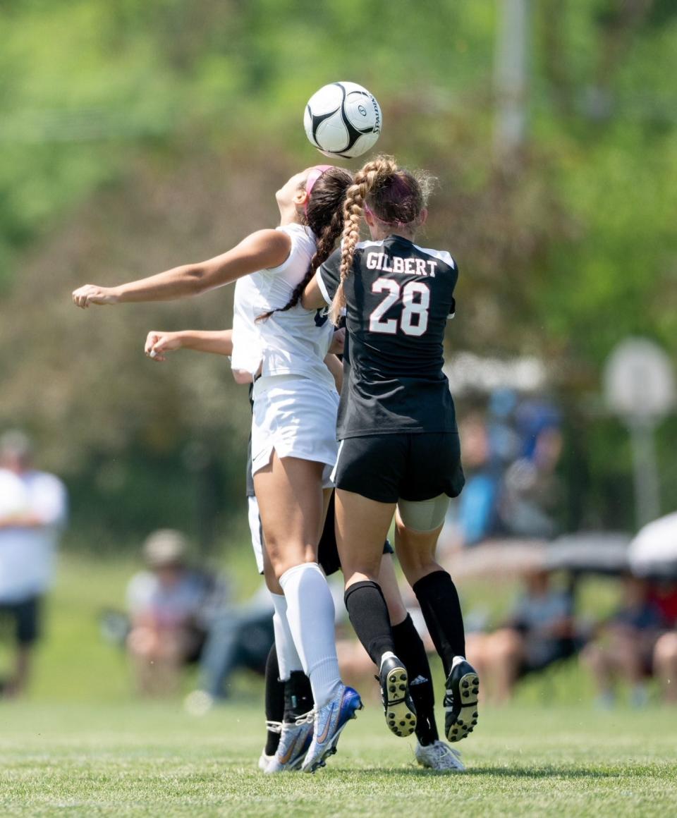 Gilbert midfielder Nora Kalvik (28) comes up to defend a Bishop Heelan player during the 1A championship game of the girls state soccer tournament Saturday at the Cownie Soccer Park in Des Moines. Gilbert fell by a 2-0 score to finish state runner-up for the first time in program history.