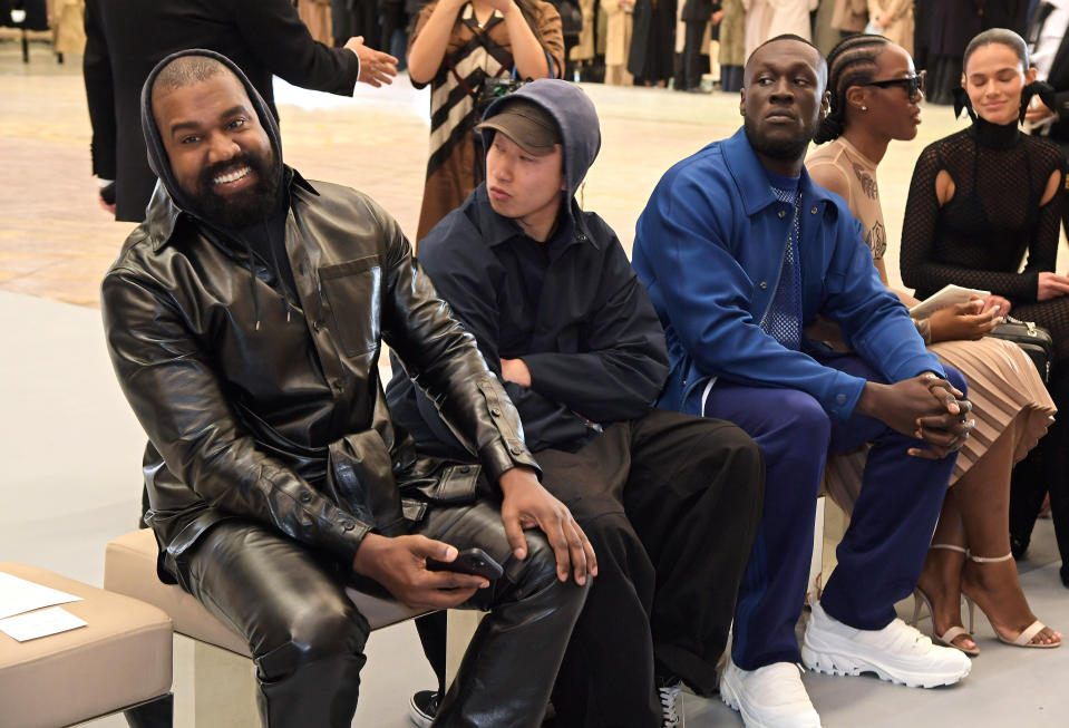 Kanye West, guest, Stormzy, Melissa Holdbrook-Akposoe aka Melissa's Wardrobe and Bruna Marquezine attend the Burberry spring 2023 show.