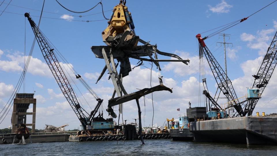 PHOTO: The Chesapeake 1000 (“Chessy”) floating crane equipped with “Gus” the hydraulic grabber, wrestle a 90-ton piece of residual wreckage Friday morning, June 7, 2024, from the Fort McHenry Federal Channel.  (Bobby Petty/U.S. Army Corps of Engineers, Baltimore District)