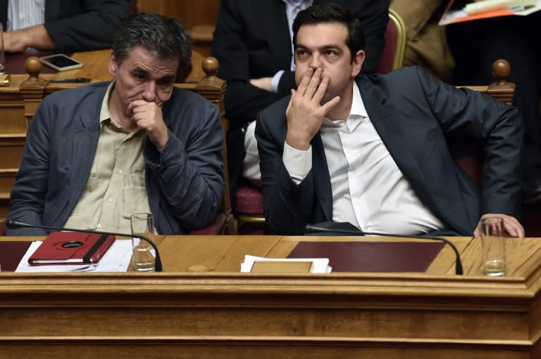 Running contrary to his promises to eliminate austerity once in power, the bailout has put major strain on Prime Minister Alexis Tsipras (R)