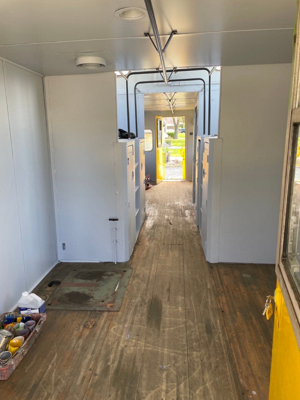 White walls and oak wood flooring installed in the Chessie System caboose.