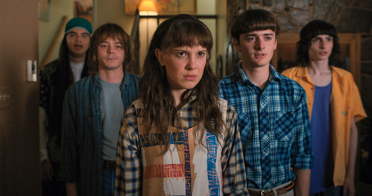  Eleven, Mike, Will and friends stare into the distance in an official image from Stranger Things season 4 