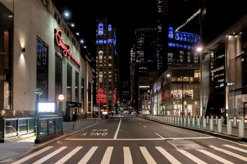 FILE PHOTO: An empty street is seen near Wall street during the outbreak of the coronavirus disease (COVID-19) in Manhattan