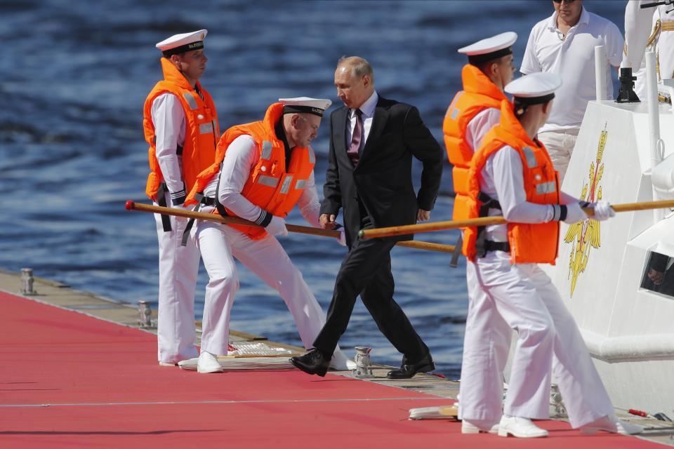 Russian President Vladimir Putin, center, arrives to attend the military parade during the Navy Day celebration in St.Petersburg, Russia, Sunday, July 26, 2020. (AP Photo/Dmitri Lovetsky, Pool)