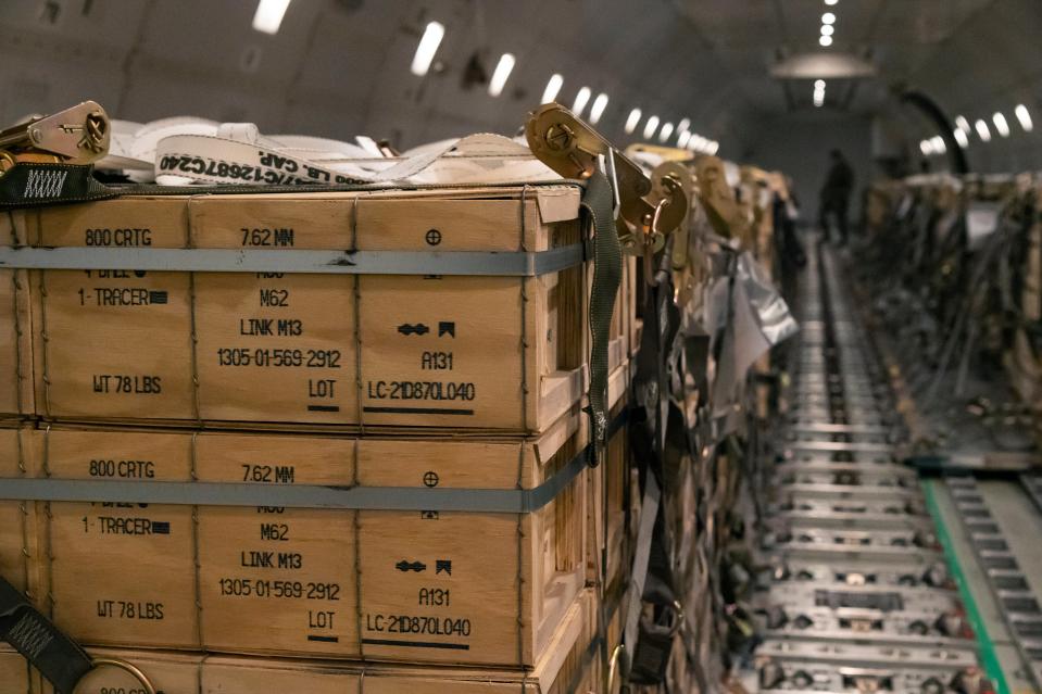 In this image provided by the U.S. Air Force, pallets of ammunition, weapons and other equipment bound for Ukraine are loaded on a plane by members from the 436th Aerial Port Squadron during a foreign military sales mission at Dover Air Force Base, Delaware on 3 January 2022 (AP)