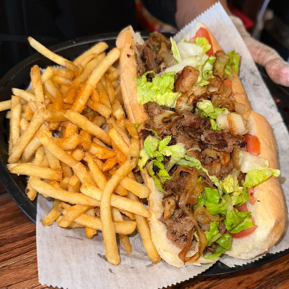 Table of Love cheesesteak sandwich with fries in Hopewell, Va.