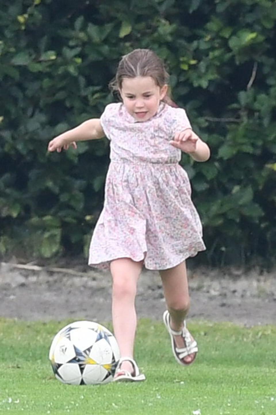 Even while wearing sandals and a dress, Charlotte chased after the ball.