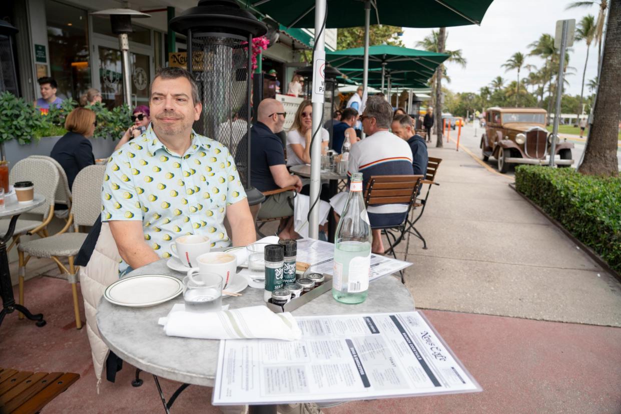 <span>Guardian reporter Richard Luscombe at the News Cafe in Miami Beach, Florida.</span><span>Photograph: Josh Ritchie/The Guardian</span>