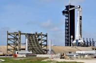 New construction surrounds the SpaceX Crew Dragon capsule atop a Falcon 9 booster rocket on historic Pad 39A at Kennedy Space Center at Cape Canaveral