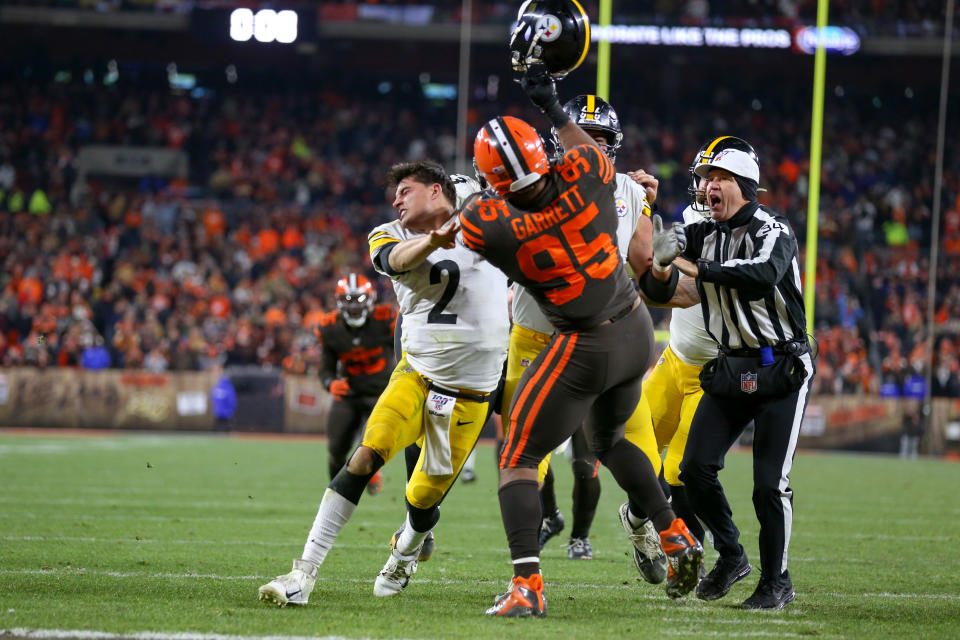 Cleveland Browns defensive end Myles Garrett swings at Pittsburgh Steelers quarterback Mason Rudolph with Rudolph's own helmet at FirstEnergy Stadium on Thursday night.