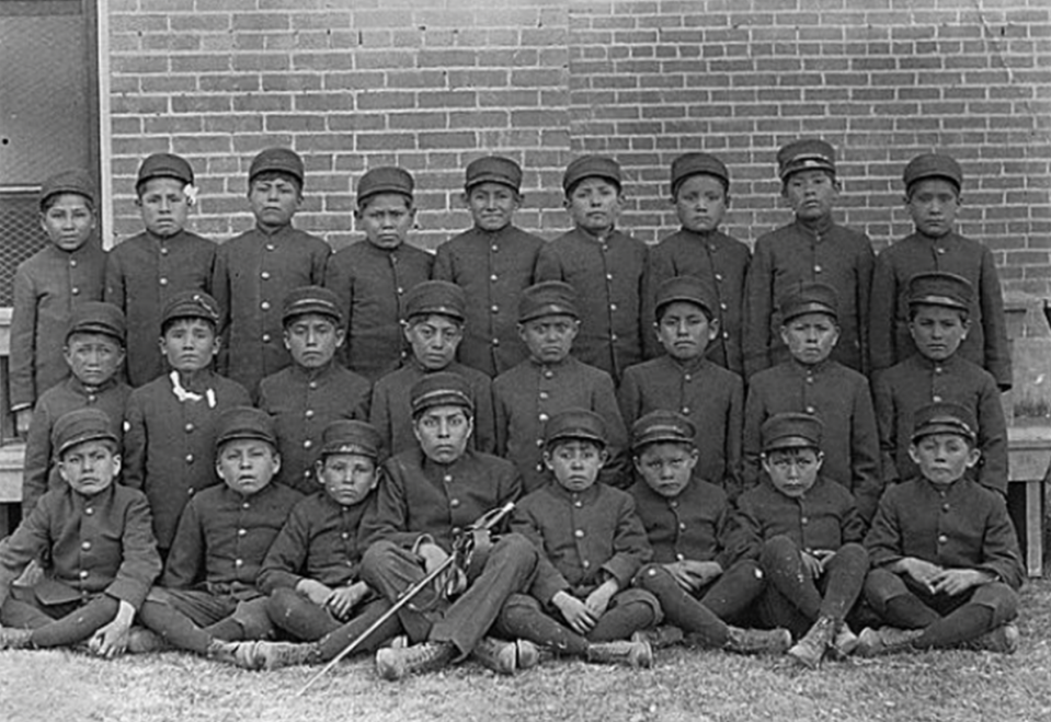 Class of younger boys in uniform at the Albuquerque Indian School, circa 1900. / Credit: National Archives