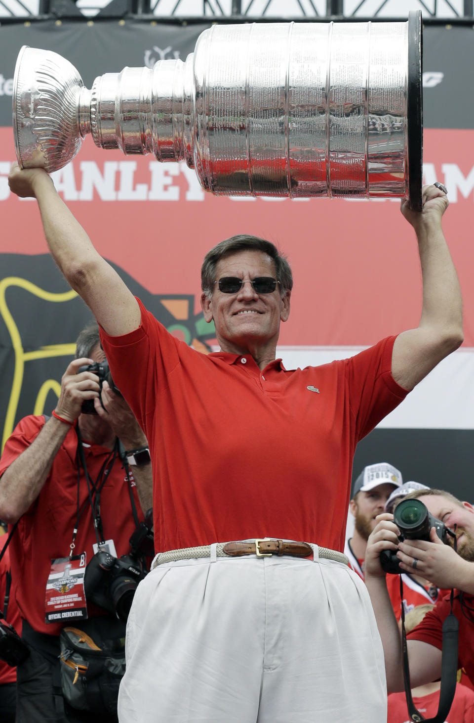 FILE - Chicago Blackhawks Chairman Rocky Wirtz holds up the Stanley Cup during a rally at Soldier Field for the NHL hockey champions June 18, 2015, in Chicago. Wirtz, who won three Stanley Cup titles as owner of the Blackhawks, has died. He was 70. The Blackhawks said in a release that Wirtz died Tuesday, July 25, 2023, and it said it was a “sudden passing.” But no further details were provided. (AP Photo/Nam Y. Huh, File)