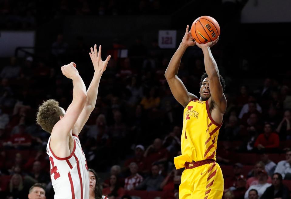 Jan 8, 2022; Norman, Oklahoma, USA; Iowa State Cyclones guard Izaiah Brockington (1) shoots a three pointer as Oklahoma Sooners forward Jacob Groves (34) defends the shot during the first half at Lloyd Noble Center. Mandatory Credit: Alonzo Adams-USA TODAY Sports