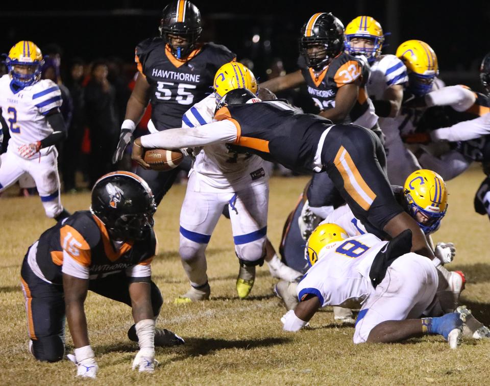 Hawthorne quarterback Tyler Jefferson (1) stretches to score a touchdown Friday against Chipley in the Class 1A state semifinal in Hawthorne.