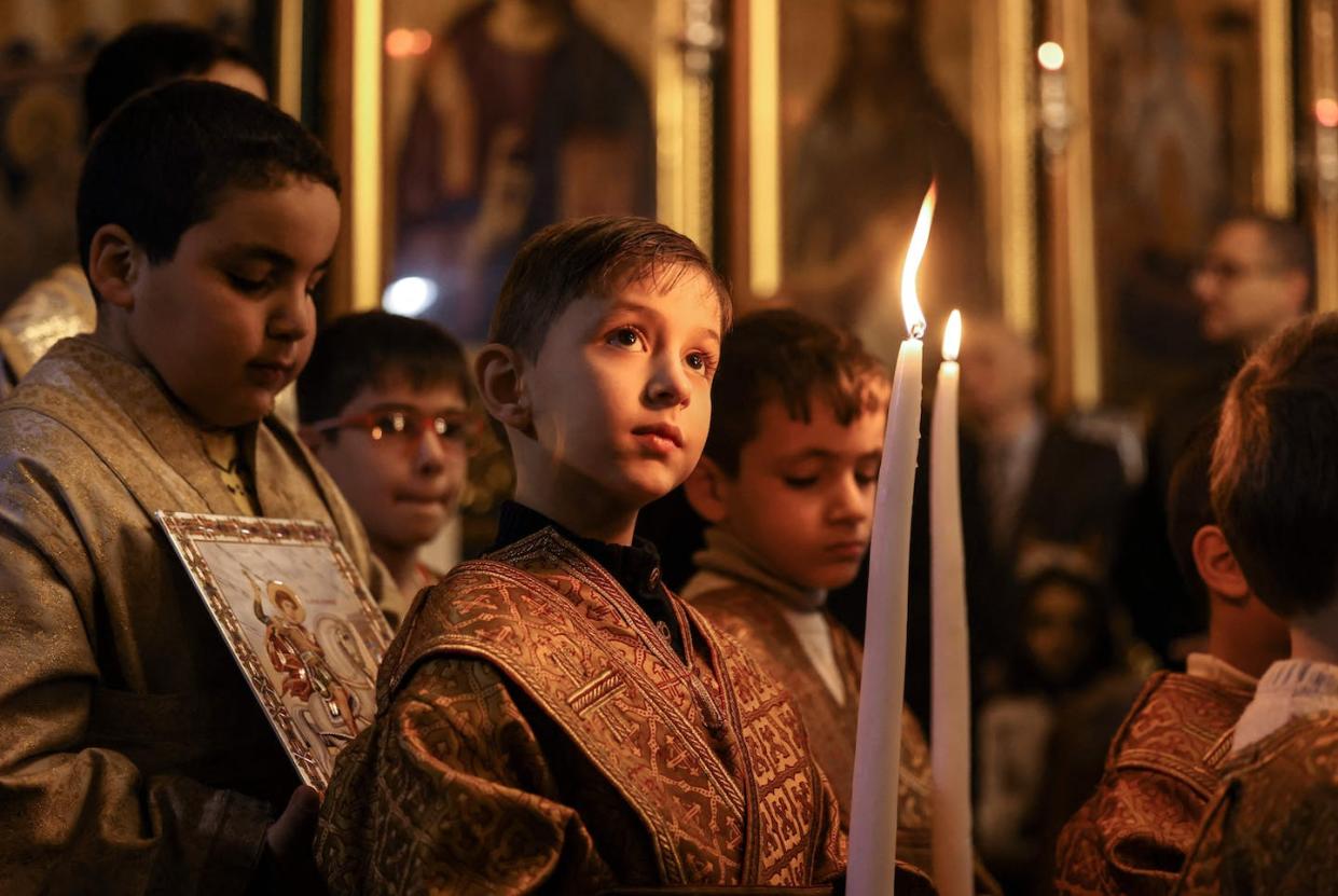 Children at an Orthodox Christmas Mass at the Church of Saint Porphyrius in Gaza City on Jan. 7, 2023. <a href="https://www.gettyimages.com/detail/news-photo/young-altar-servers-take-part-in-the-orthodox-christmas-news-photo/1246056243" rel="nofollow noopener" target="_blank" data-ylk="slk:Mahmud Hams/AFP via Getty Images;elm:context_link;itc:0;sec:content-canvas" class="link ">Mahmud Hams/AFP via Getty Images</a>