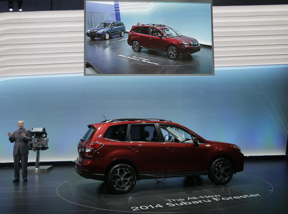 Thomas J. Doll, Executive Vice President, Chief Operating Officer and Chief Financial Officer for Subaru of America, Inc.talks about the 2014 Subaru Forester XT during it's world debut at the LA Auto Show in Los Angeles, Wednesday, Nov. 28, 2012. (AP Photo/Chris Carlson)