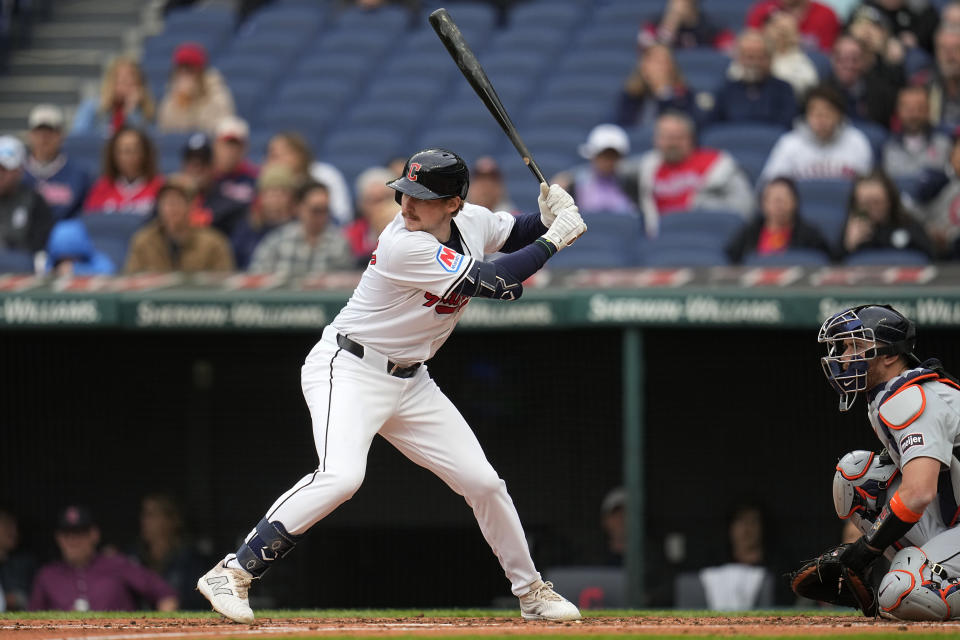 Cleveland Guardians' Kyle Manzardo bats in the second inning of a baseball game against the Detroit Tigers, Monday, May 6, 2024, in Cleveland. Tigers catcher Carson Kelly is at right. (AP Photo/Sue Ogrocki)